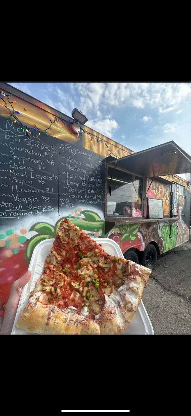 Fresh hand-tossed pizza at Nikki's Pizza Windsor