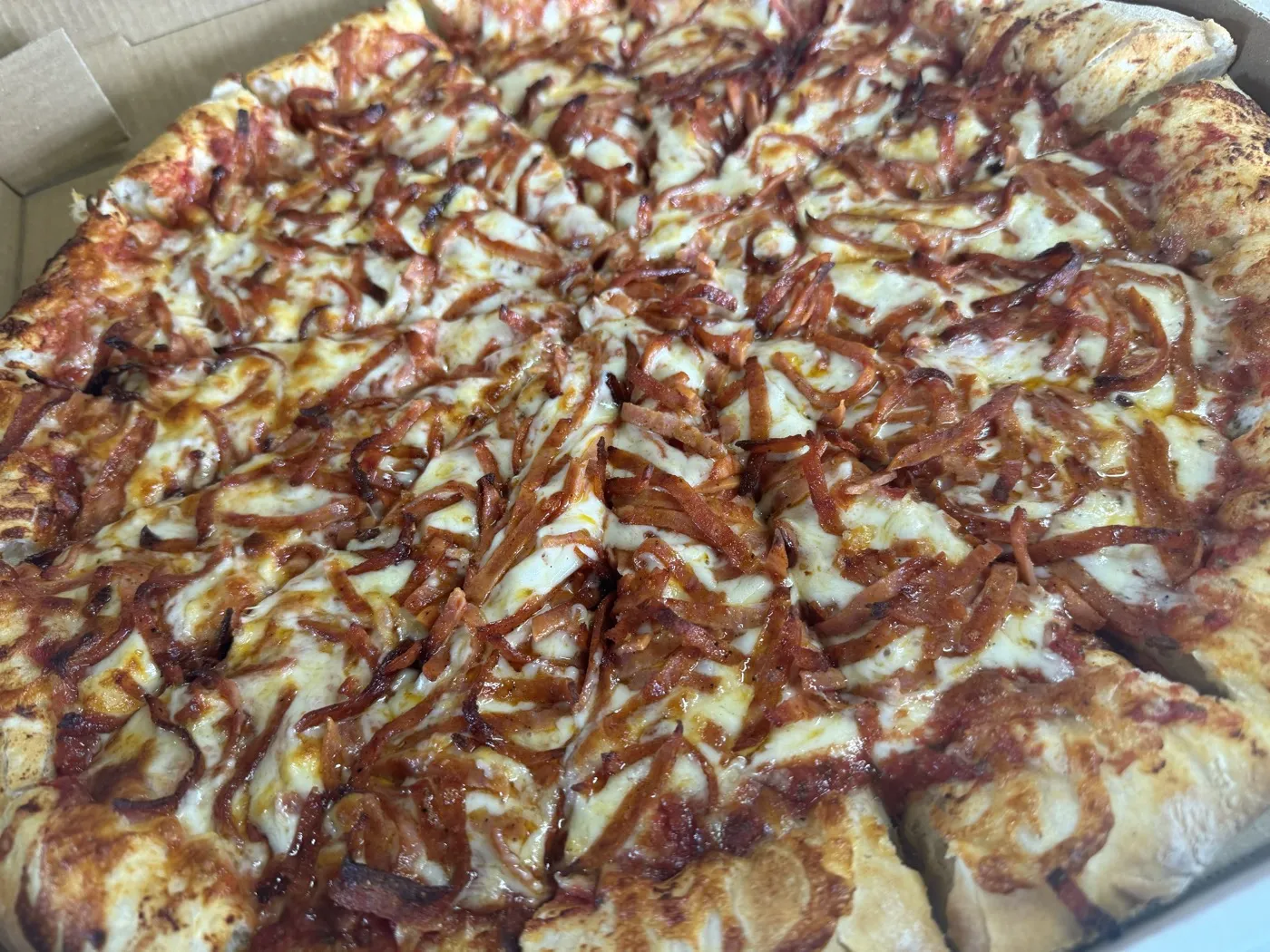 Loaded specialty pizza fresh from the oven at Nikki's Pizza Windsor